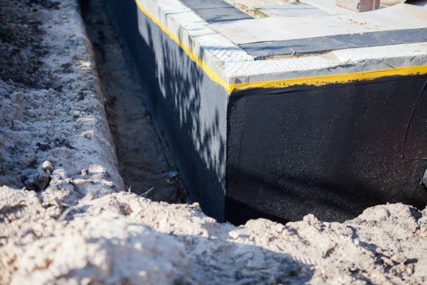 Professional Basement Waterproofing technician working in New Straitsville, OH